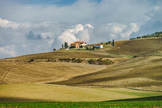 Villa in Italy, old farmhouse in the waves of tuscanian fields and hills photo