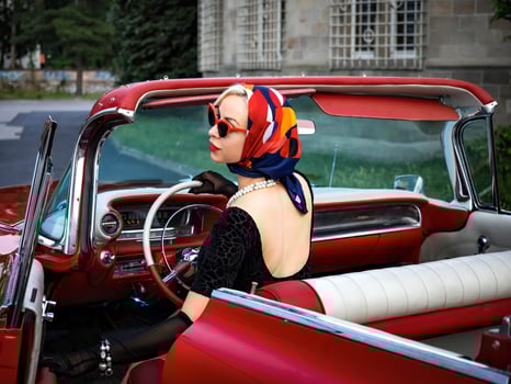 Old-timer red Cadillac and a beautiful young girl photo