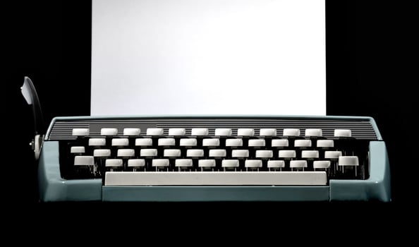 Vintage typewriter, writer or author's tool, inspiration and creativity. On a black background. photo