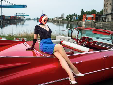 Old-timer red Cadillac and a beautiful young girl photo