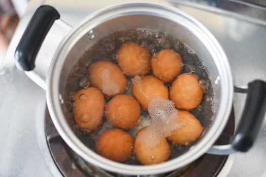 Boiled eggs in a hot pot on the stove, egg cooking healthy eating concept, Eggs menu food photo