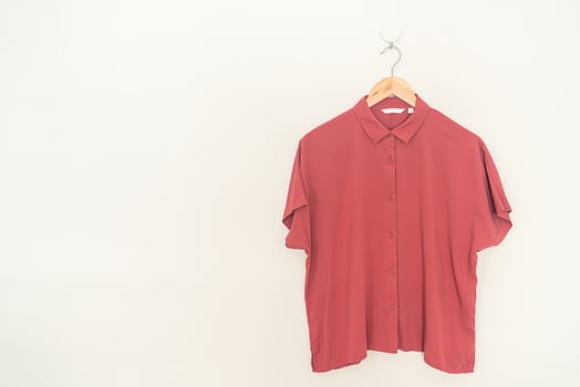 beautiful woman shirt hanging on wall photo