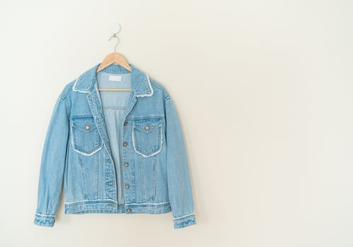 woman jacket jean hanging on wall photo