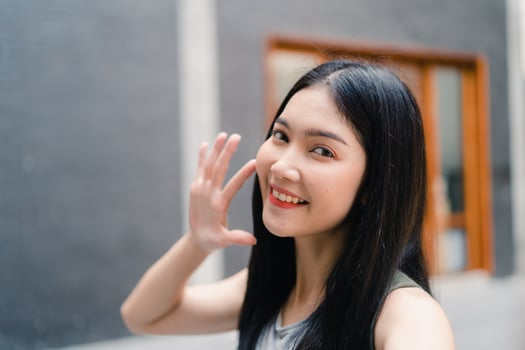 Asian blogger woman travel in Beijing, China, backpacker female using mobile phone make vlog and live in social media while spending sweet time in holiday trip. Women travel in city concept. photo