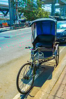Old bike rickshaw rikshaw trishaw in Don Mueang Bangkok Thailand. photo