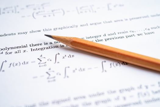 Pencil on mathematic formula exercise test paper in education school. photo