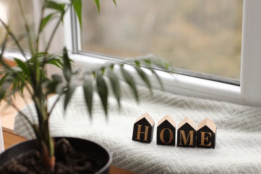 Still life home decor in a cozy house with wooden letters with the inscription home. The concept of decor and comfort. selective focus photo