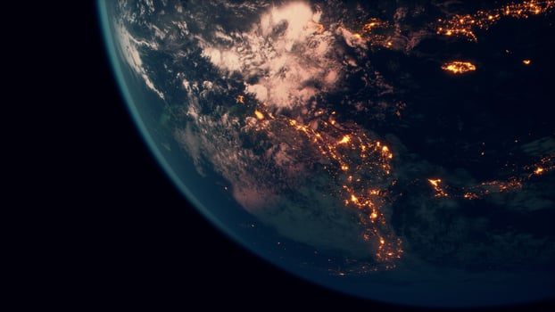 Earth planet viewed from space at night showing the lights of countries photo