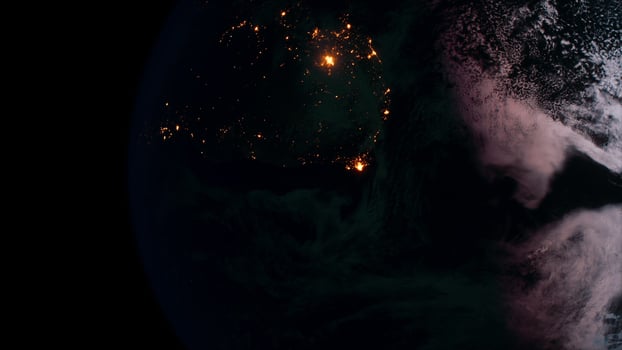 Earth planet viewed from space at night showing the lights of countries photo