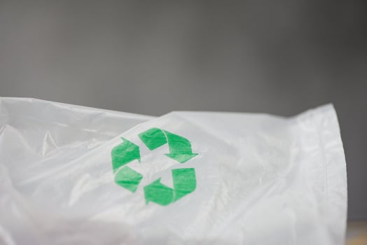 Plastic world or World Environment Day Concept - Green recycle logo in a plastic bag Reduce environmental zero waste concept shopping bag photo