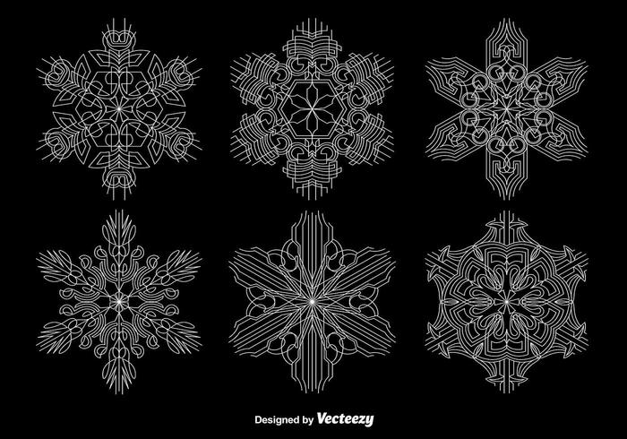 Copos de nieve geométricos ornamentales vector