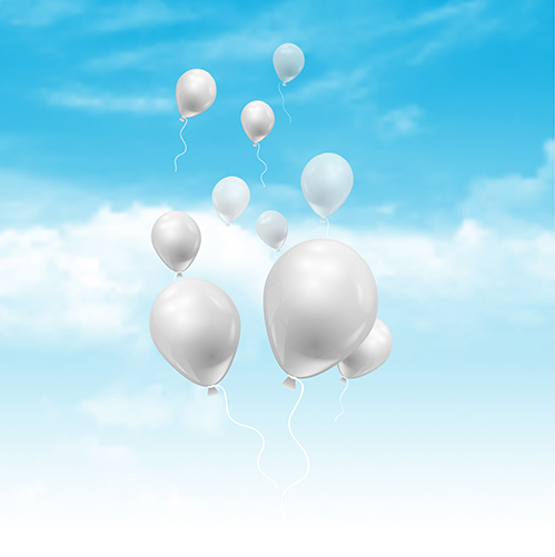 Balloons floating in a blue sky with fluffy white clouds 