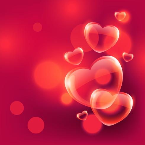 Beautiful love hearts bubbles floating in air on red bokeh 