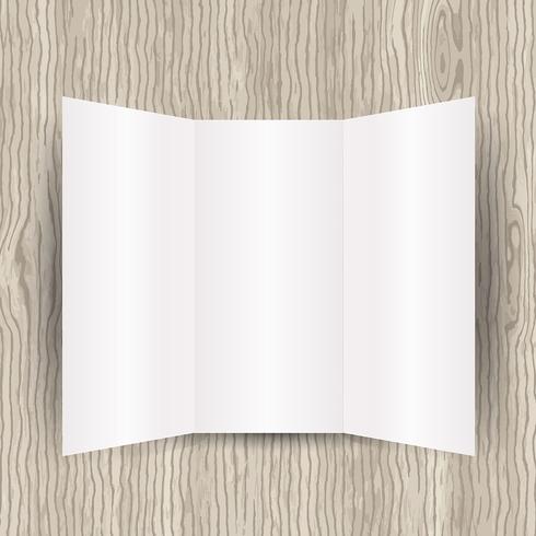 Papel en blanco sobre fondo de madera vector