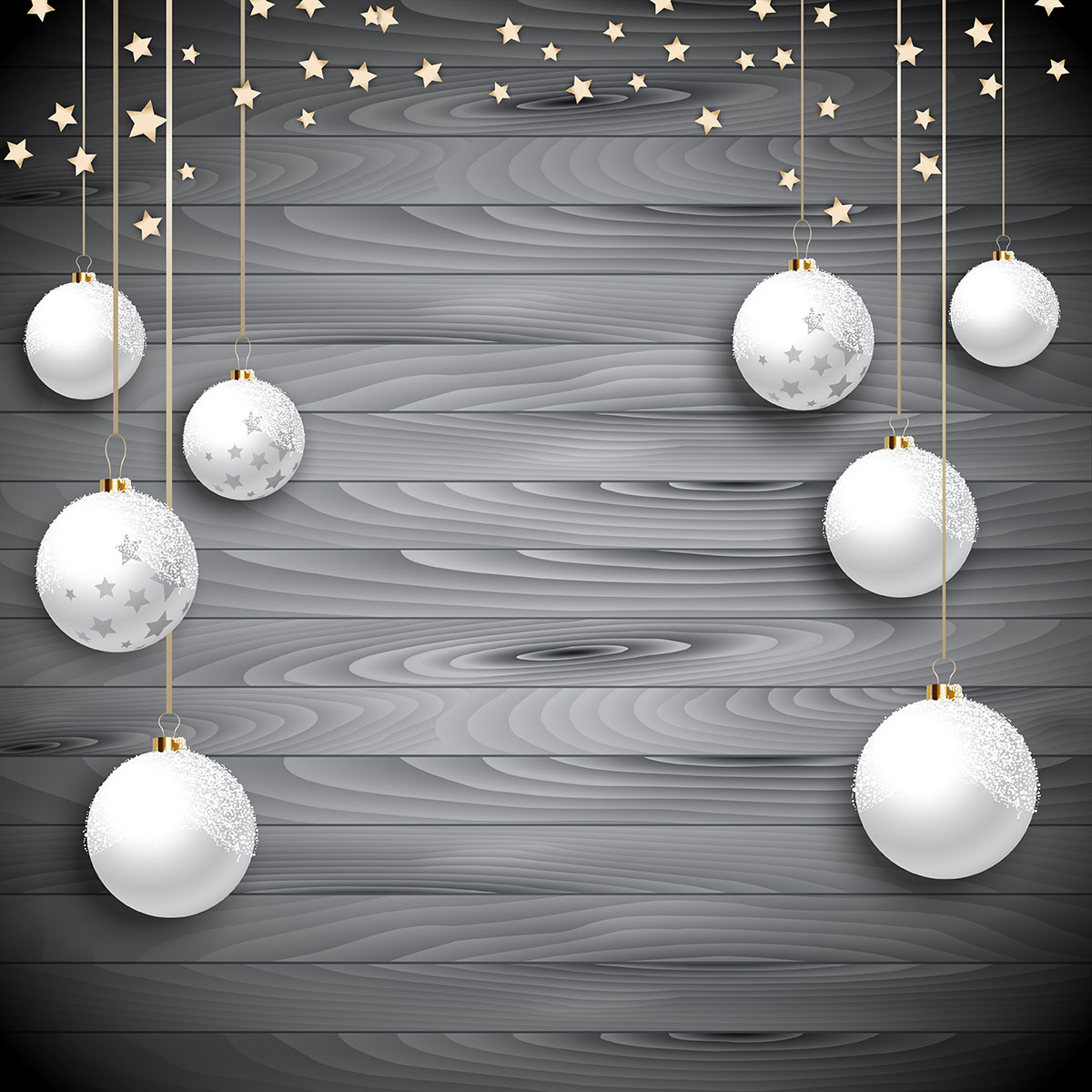 Hanging Christmas baubles on a wooden background 