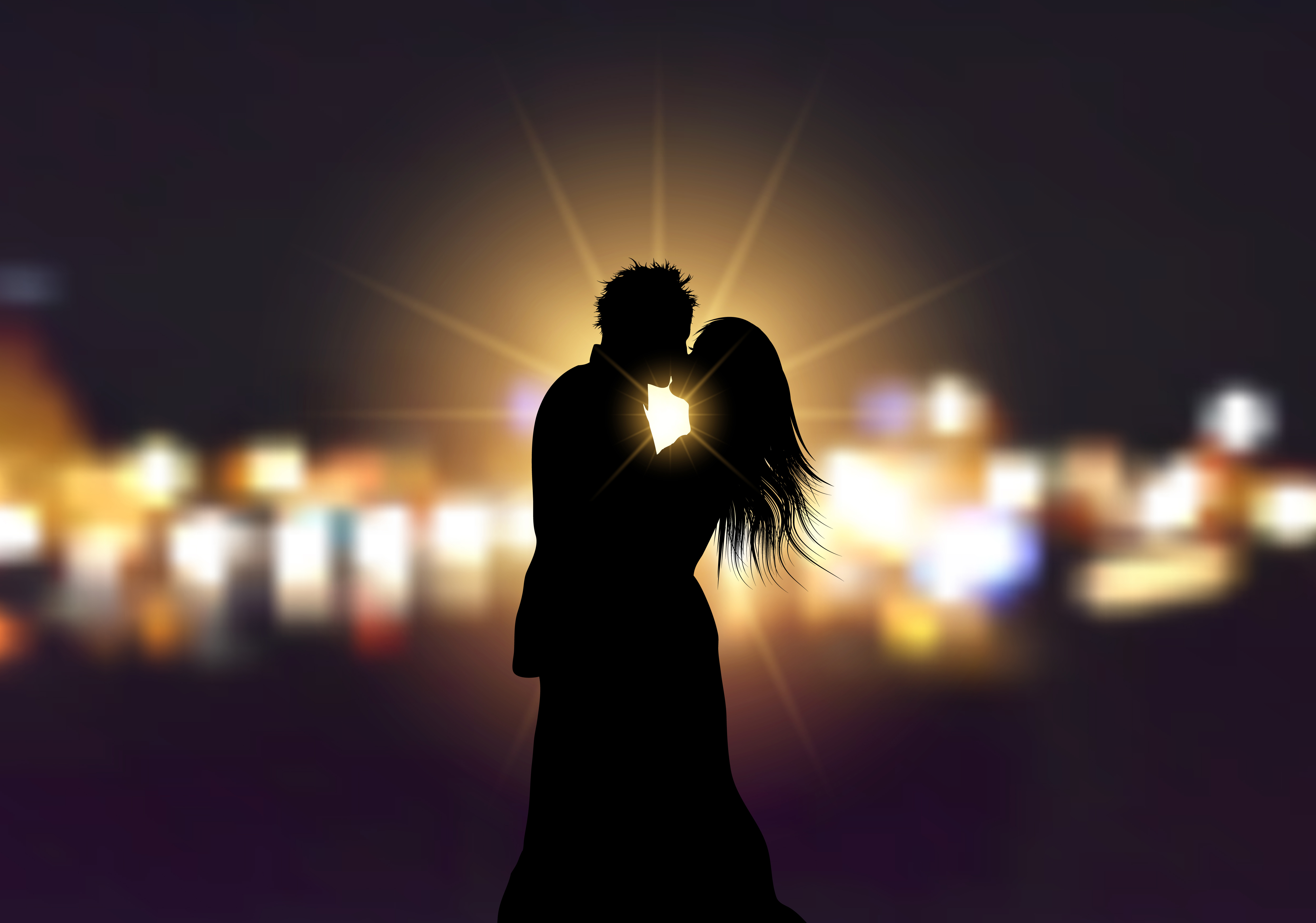 Silhouette of a loving couple  on bokeh lights background  