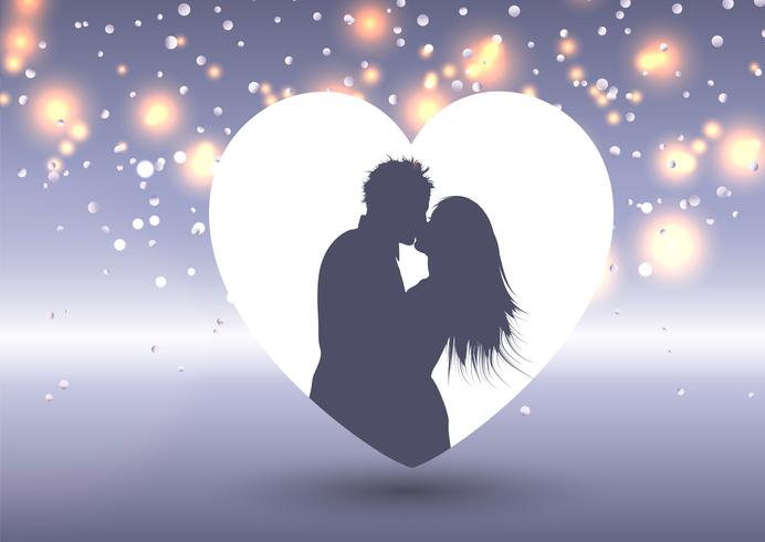 Silhouette of a kissing couple in a heart  vector