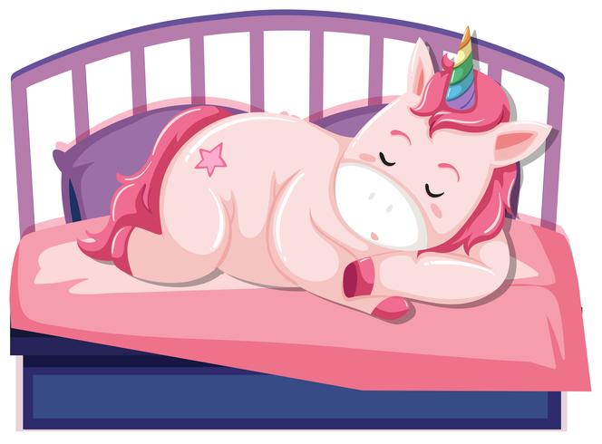 Un unicornio durmiendo en la cama. vector