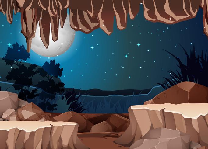 Una vista del paisaje desde la entrada de la cueva. vector