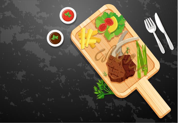 Lambchop and vegetables on wooden board vector