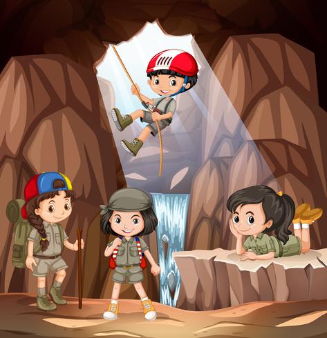 Boy and girl scout exploring the cave vector