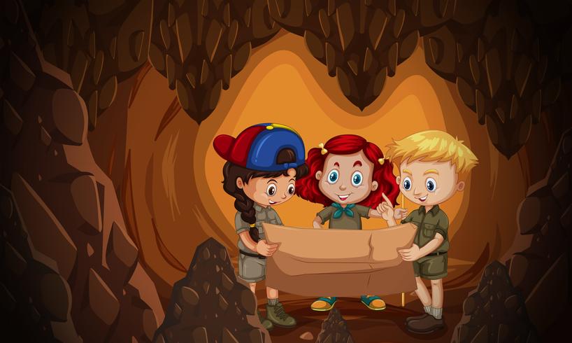 Un grupo de niños leyendo el mapa de la cueva. vector