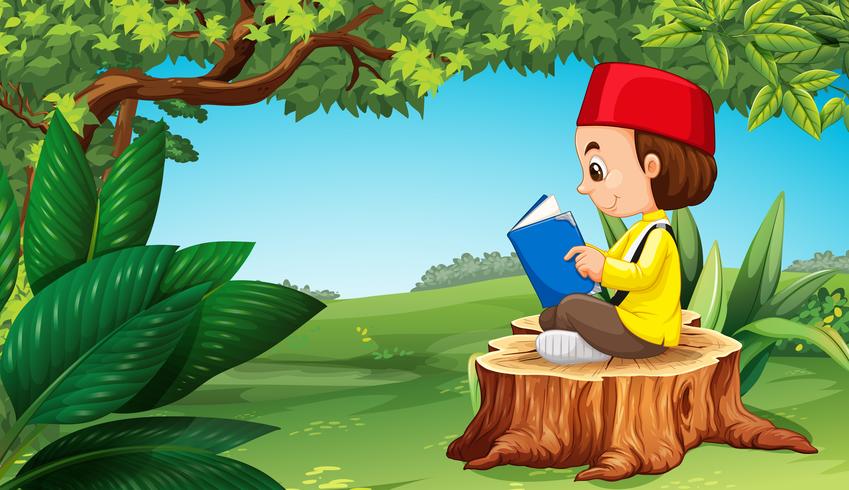 Muslim boy reading book in park vector