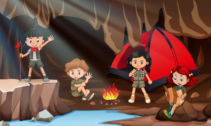 Children camping in a cave vector