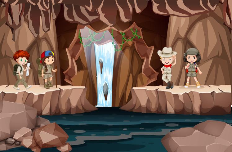 Niños explorando una cueva con cascada. vector