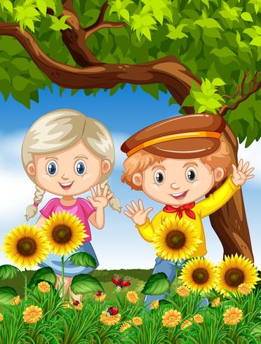 Niño y niña en jardín de girasol vector