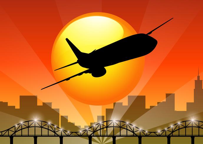 Silhouette view of airplane flying over the city vector