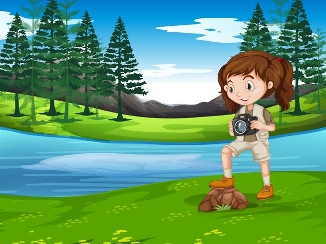 A girl taking photo in nature vector