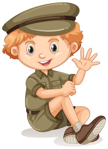 Un niño feliz sentado en un traje de safari. vector