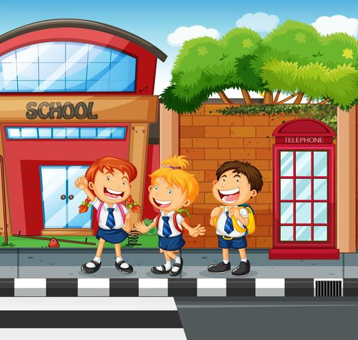 Three students waiting to cross the road vector