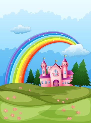 A castle at the hilltop with a rainbow in the sky