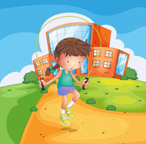 Una niña jugando en el terreno de la escuela. vector