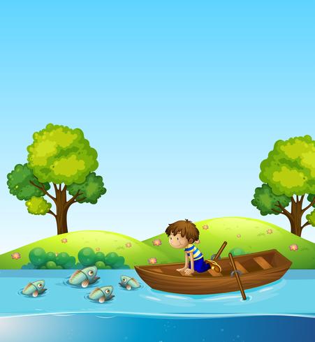 A boy on the boat watching fish vector