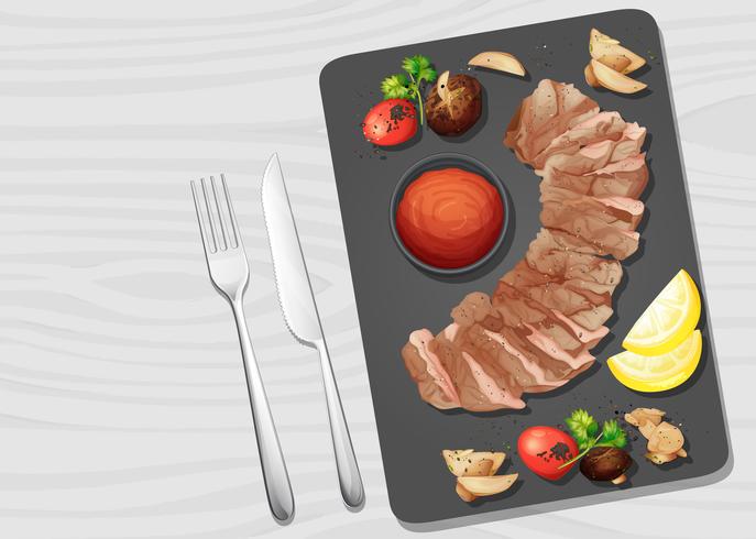 Un filete de res en un plato vector