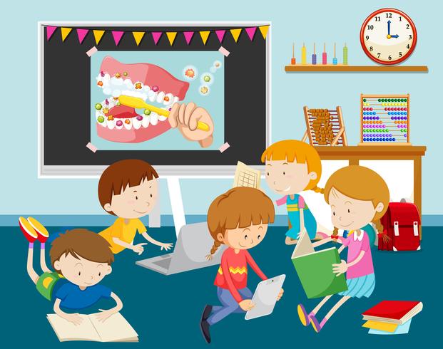 Children working on computer in classroom vector