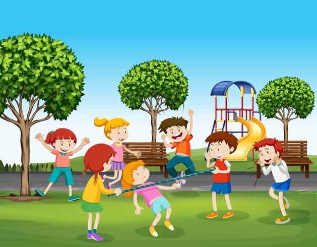 Niños y niñas jugando en el parque. vector