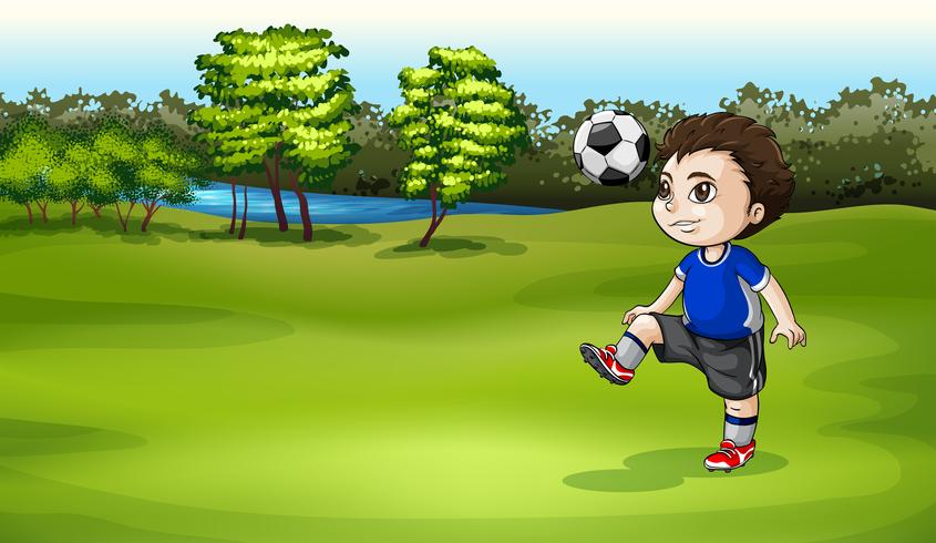 A boy playing soccer outdoor vector