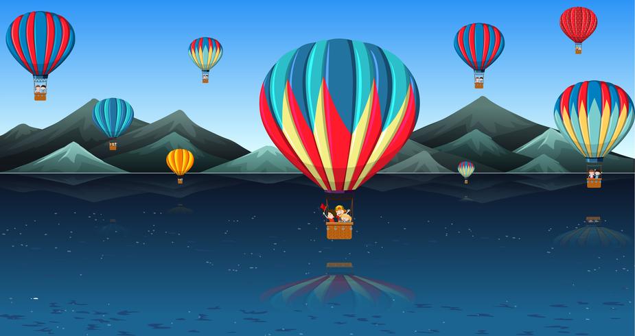 Children riding hot air balloon vector
