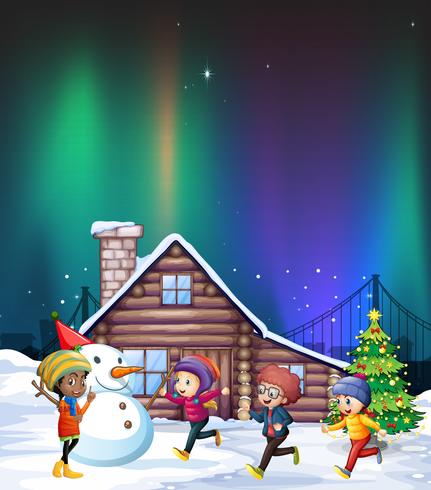 Cuatro niños jugando con la nieve en la noche. vector