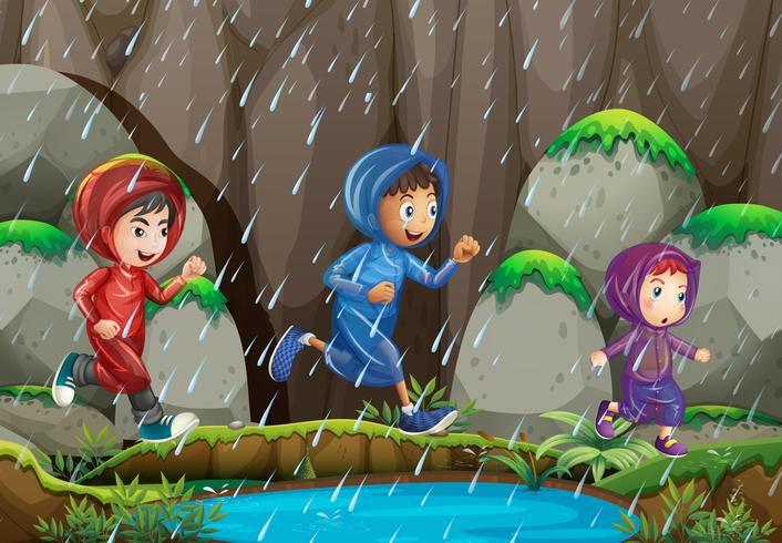 Tres niños bajo la lluvia vector