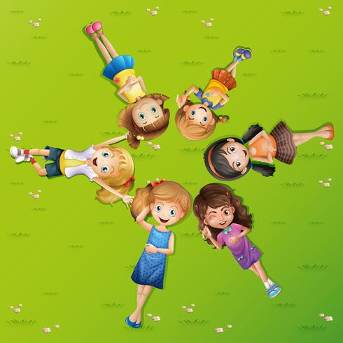 Many happy girls lying on grass vector