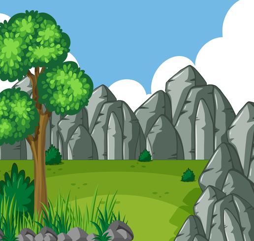 Background scene with green field and rocky mountains vector