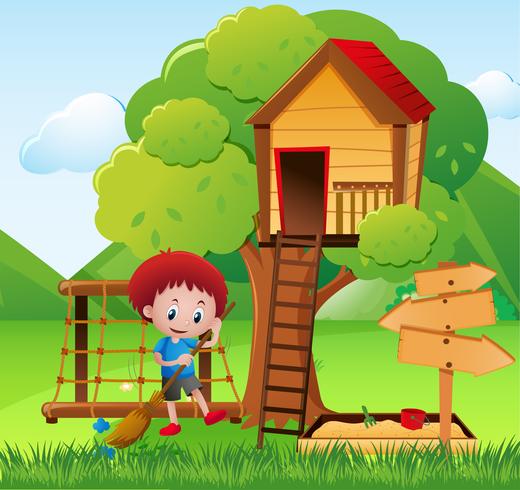 Little boy sweeping the garden vector