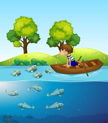 Un niño en el barco viendo peces. vector