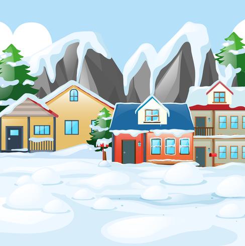 Casas en pueblo cubierto de nieve vector