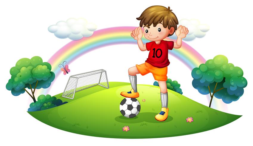 Un niño en un campo de futbol vector